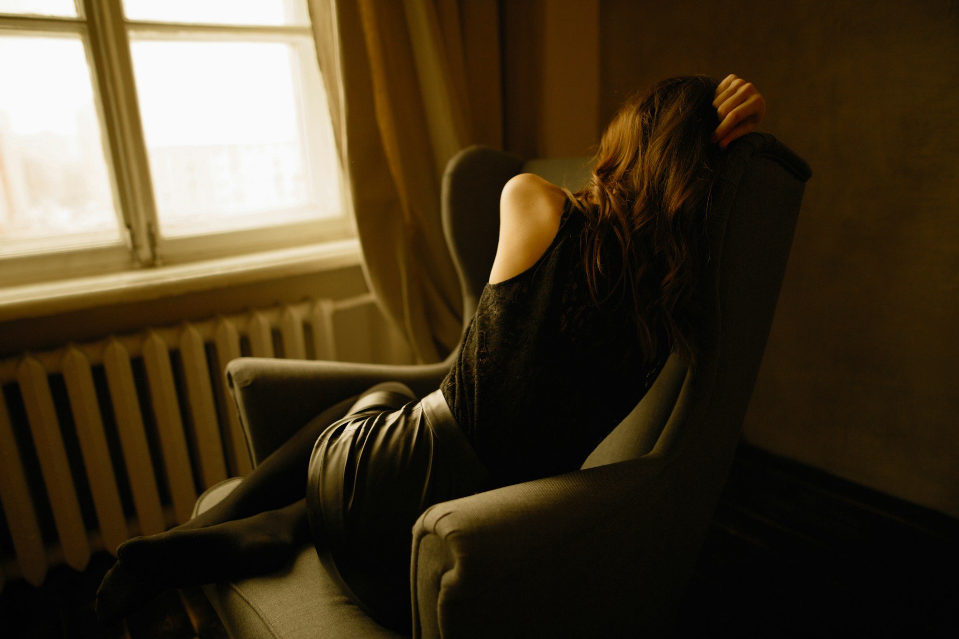 Person feeling mentally drained on couch