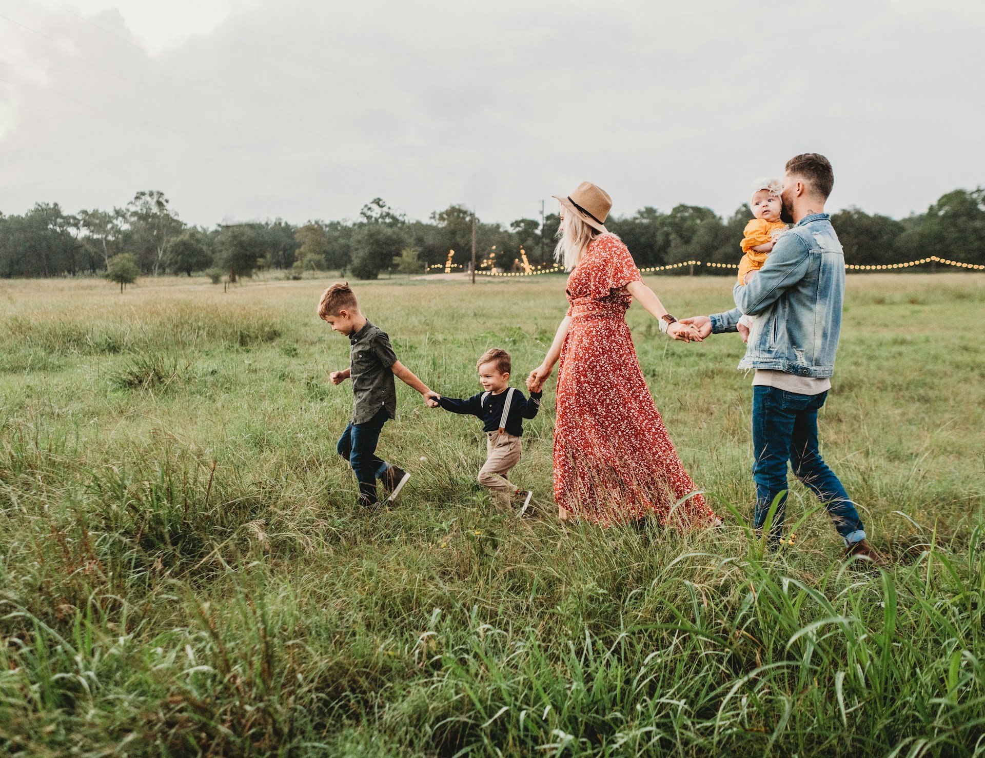 Family walking through a field