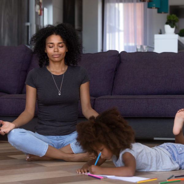 Calm,African,American,Mom,Doing,Yoga,While,Quiet,Little,Mixed